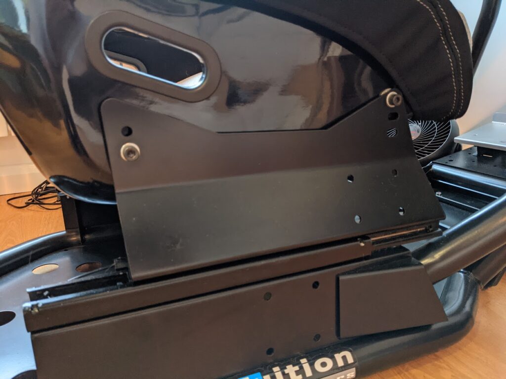 Corbeau seat mounted via standard side mounts on a slider rail