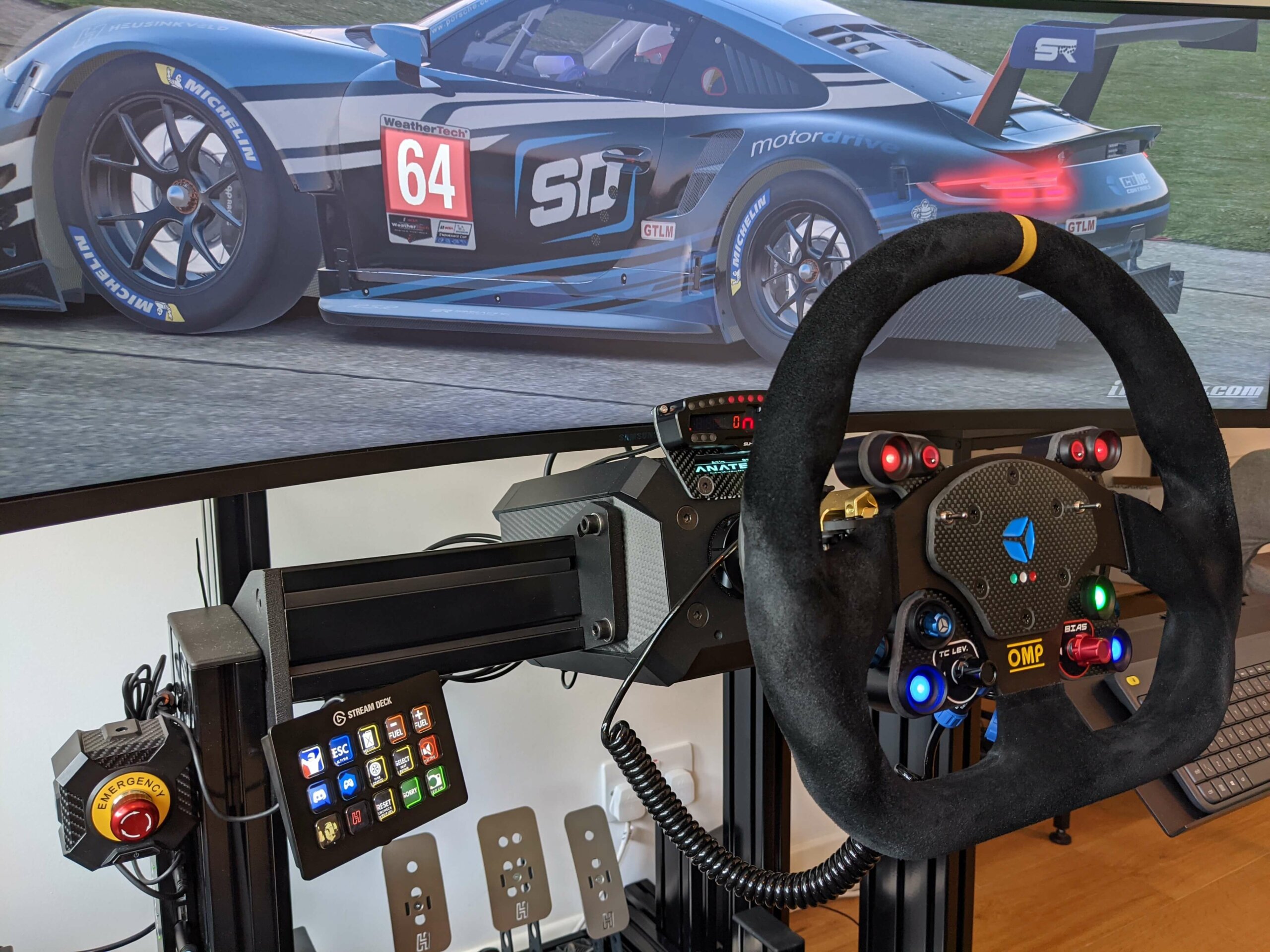 Elgato Stream Deck mounted on the side of Richard's aluminium profile rig next to a Cube Controls OMP wheel