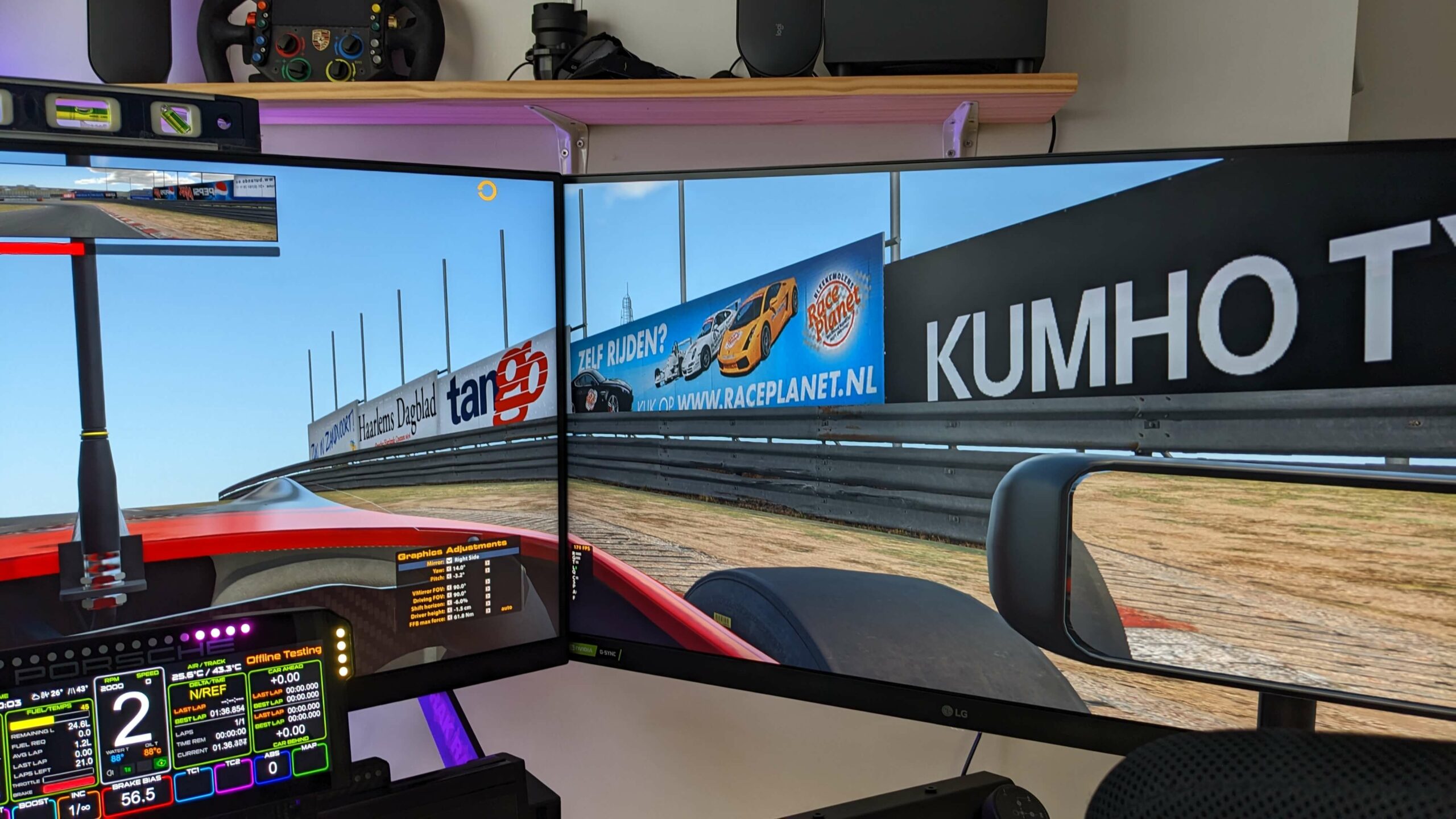 The bezel join between two LG 32GP850-B monitors showing iRacing at Zandvoort