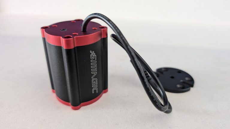 A single SIMAGIC P-HPR Haptic Pedal Reactor taken from the side