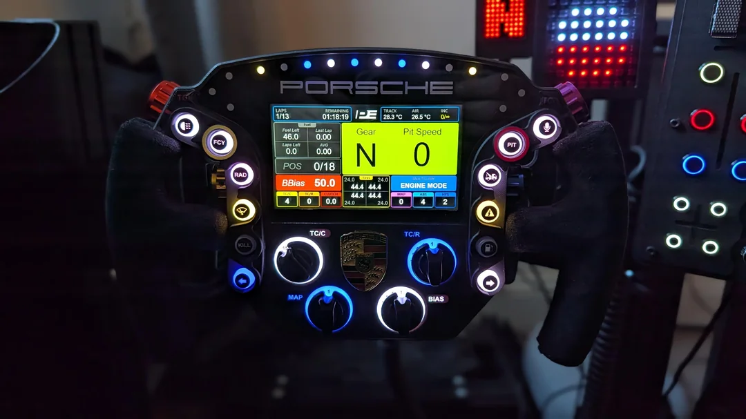 Pokornyi Engineering GTE Pro V3 steering wheel build showing aluminium dials and screen