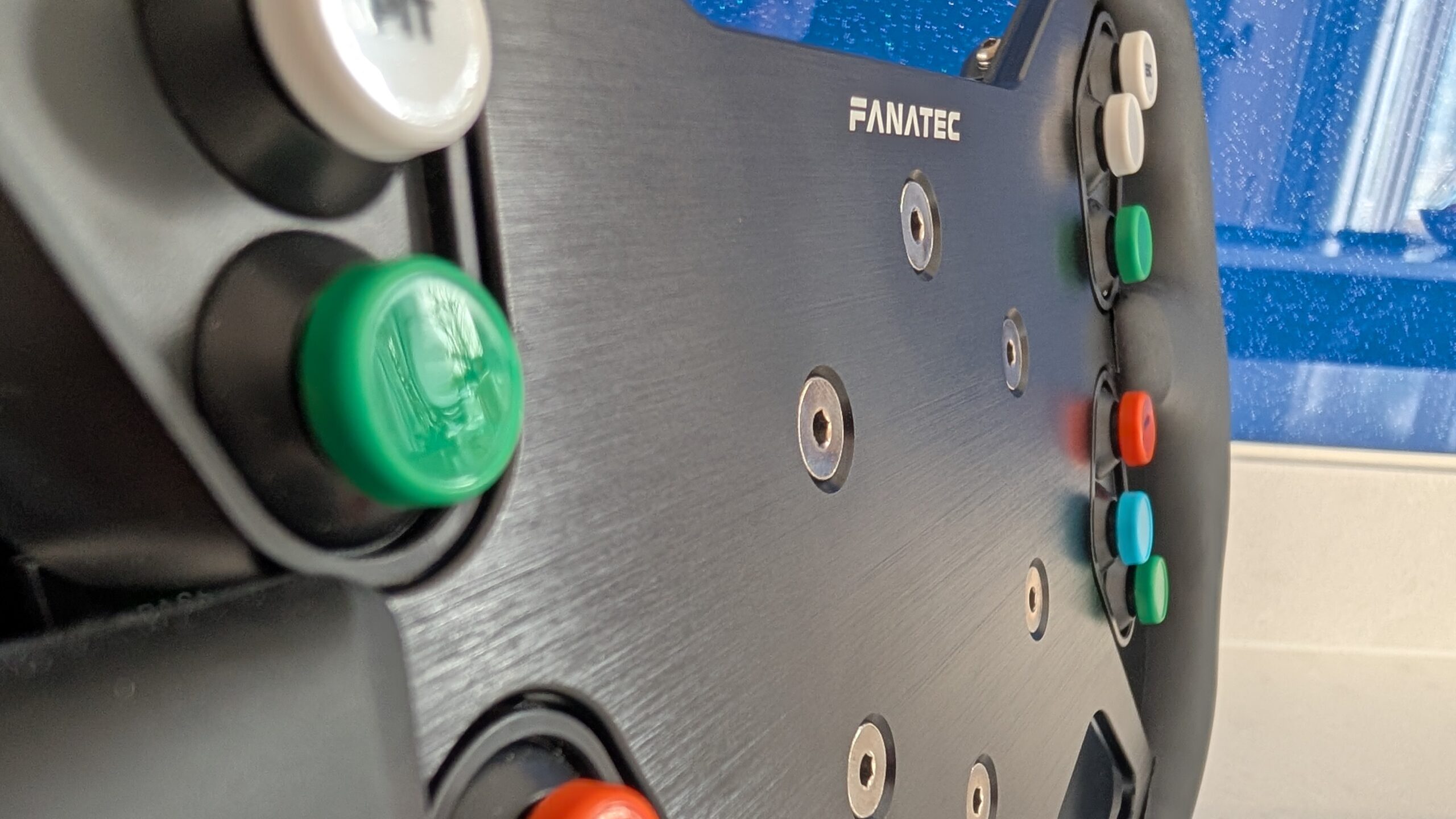 Close-up of customised button colours on the ClubSport GT3 wheel