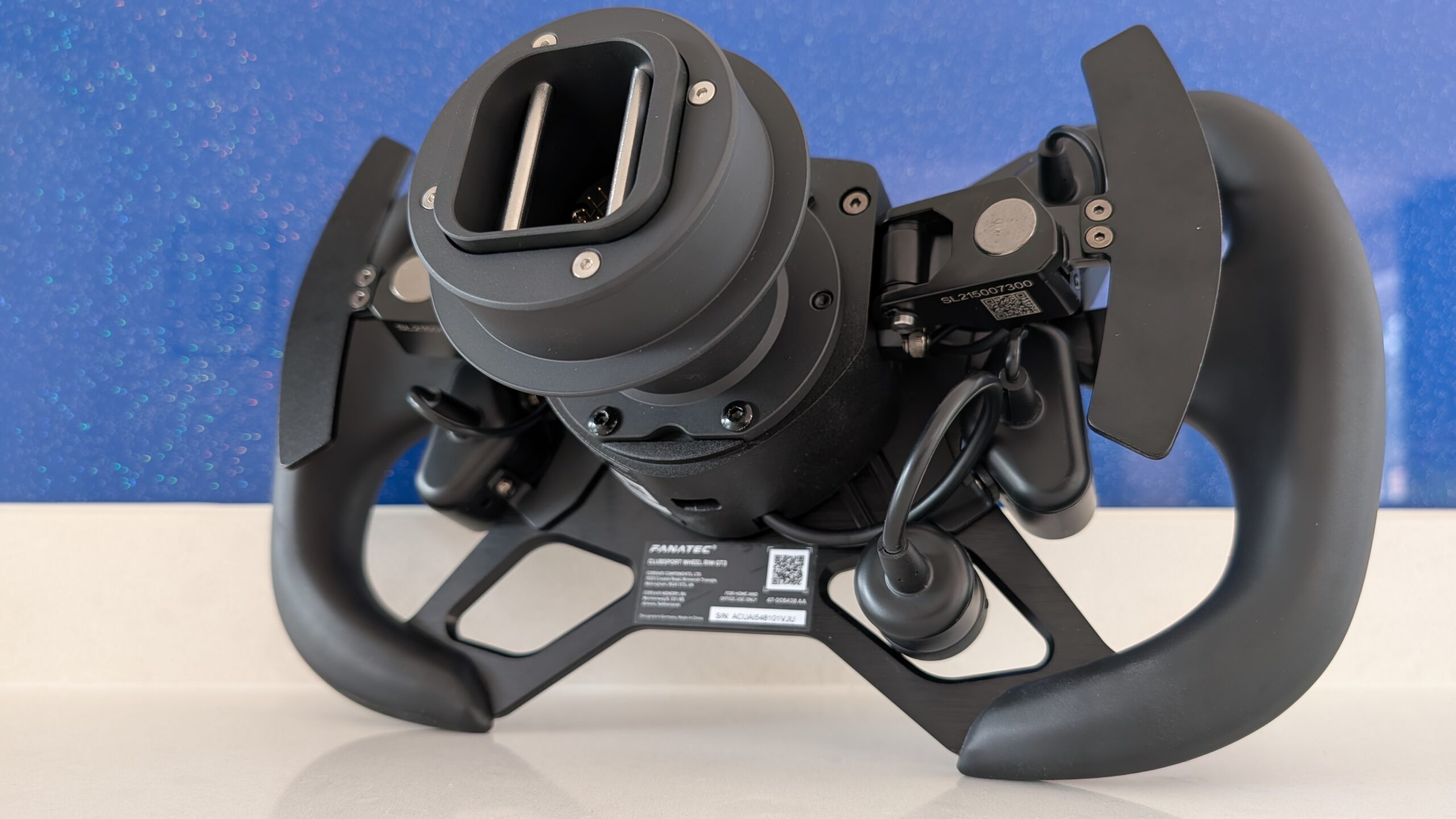 Rear view of the ClubSport GT3 wheel showing magnetic shifter paddles and hub construction