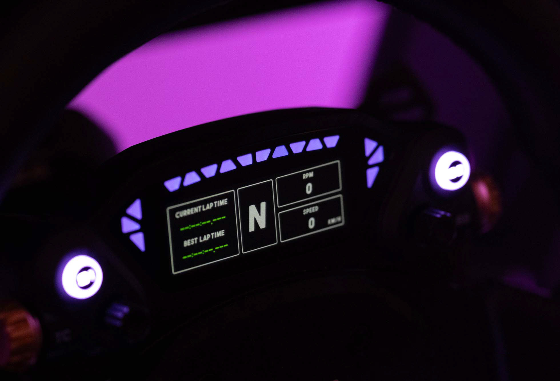 MOZA CS Pro display lit up showing telemetry data with purple RGB rev lights