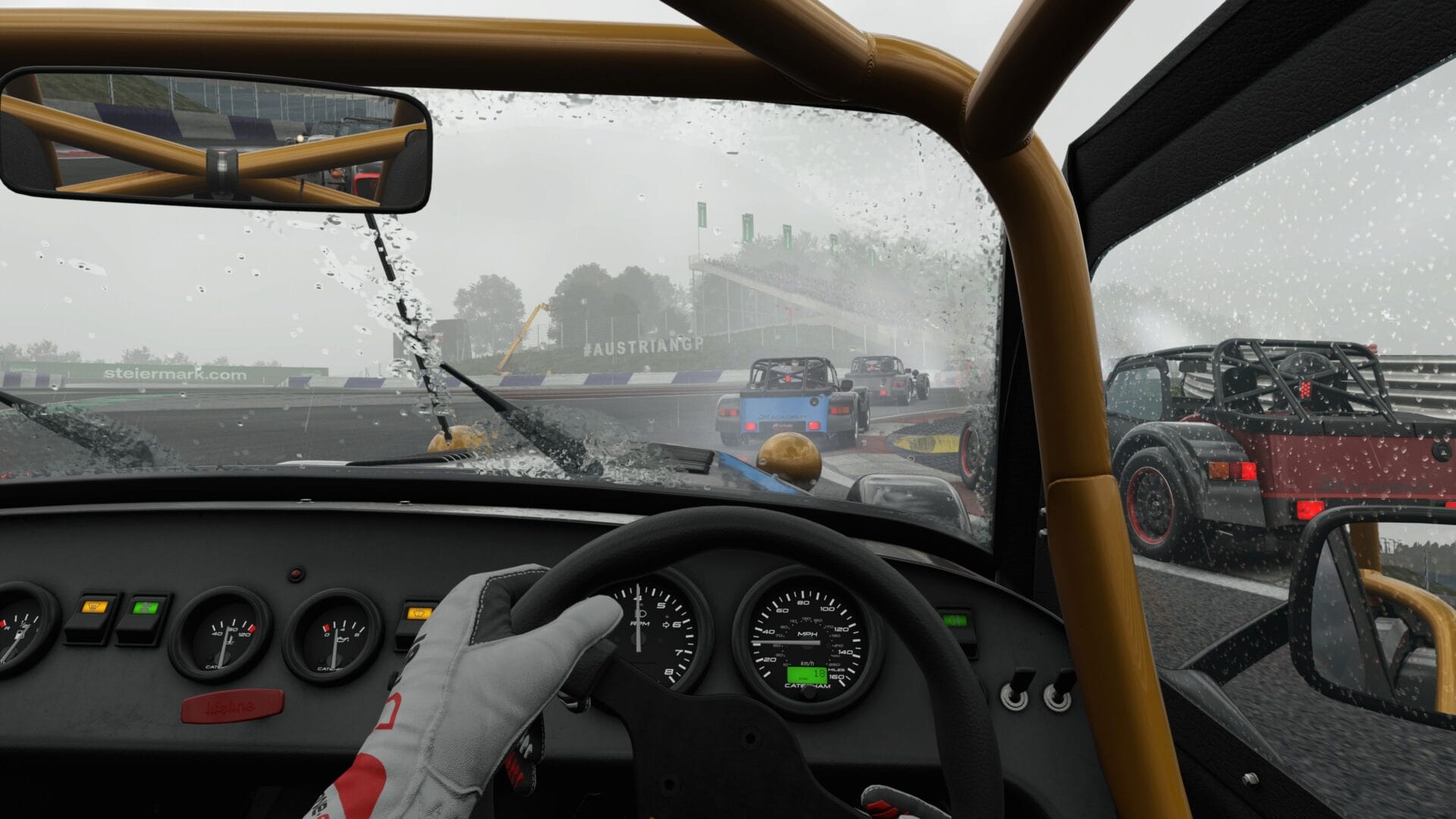 Assetto Corsa Evo Caterham Seven cockpit view in heavy rain at Red Bull Ring