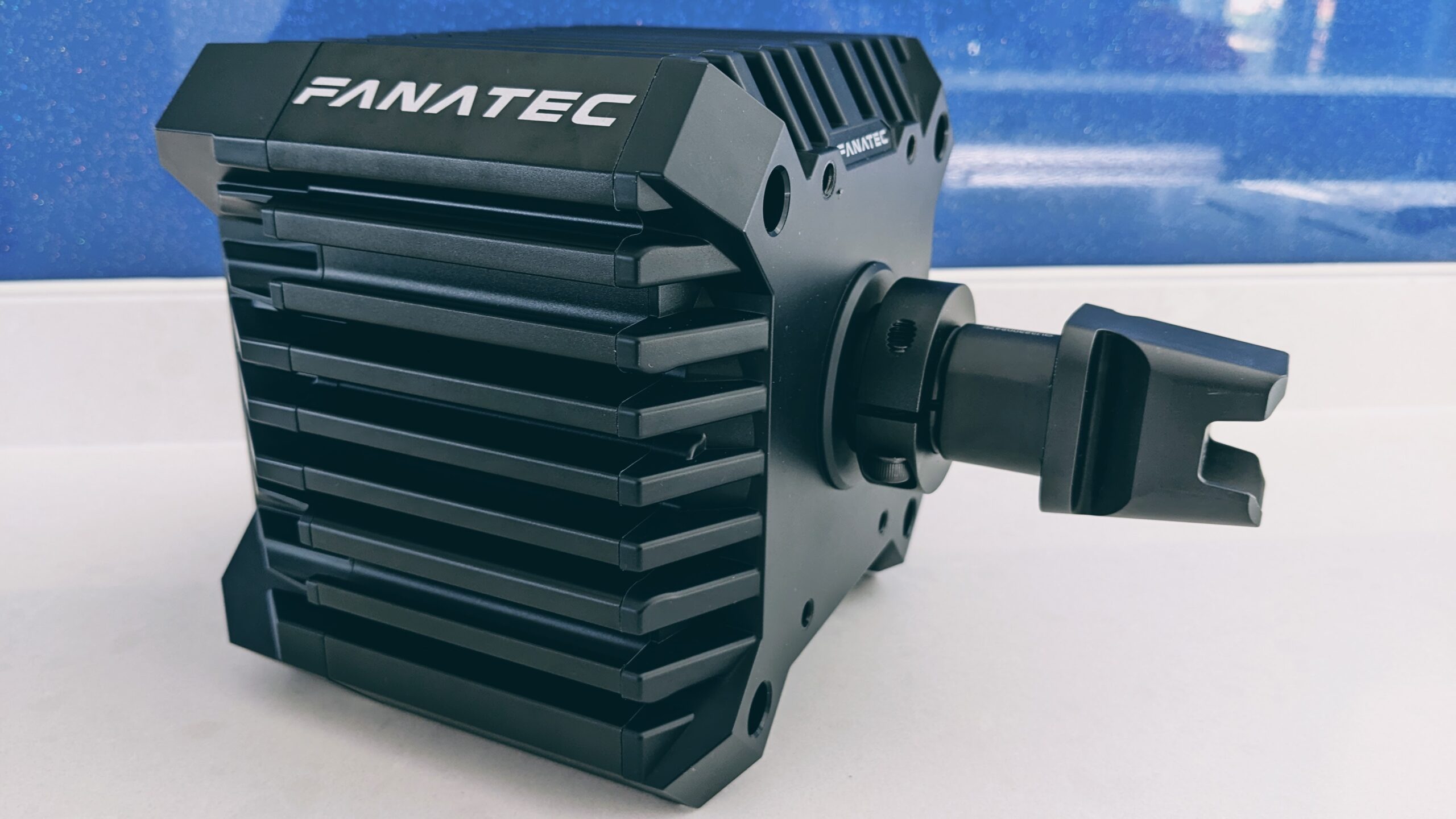 Fanatec CSL DD wheelbase with the bare steering shaft and quick release clamp visible