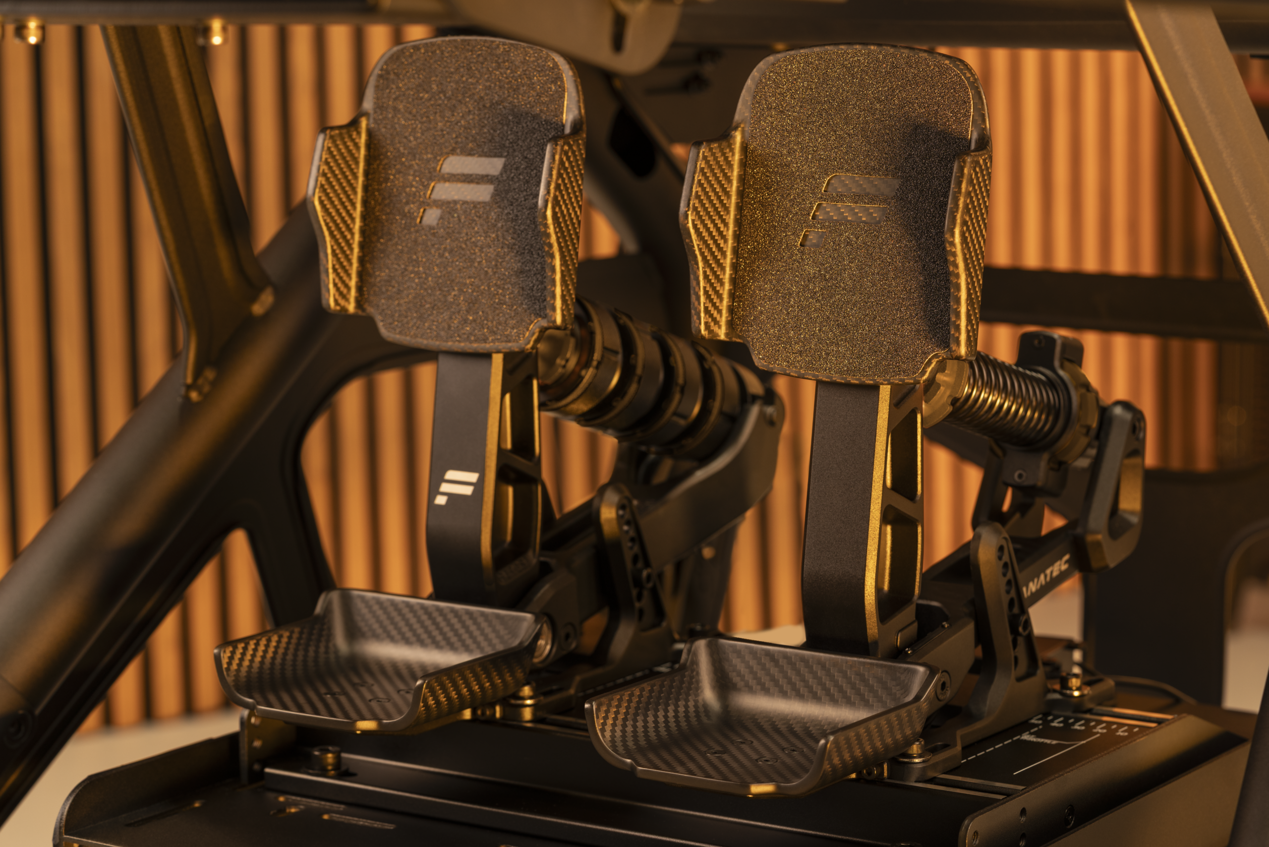 Fanatec Podium Pedals Formula variant fitted in a sim racing cockpit
