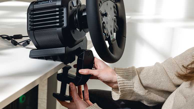 Logitech RS50 mounted on a desk via the included steel table clamp