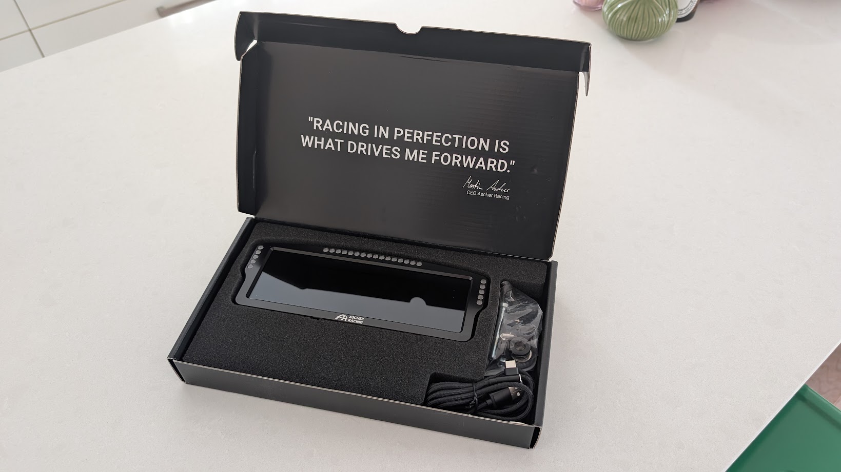 Ascher Racing 8-inch dashboard boxed and ready to set up on the worktop