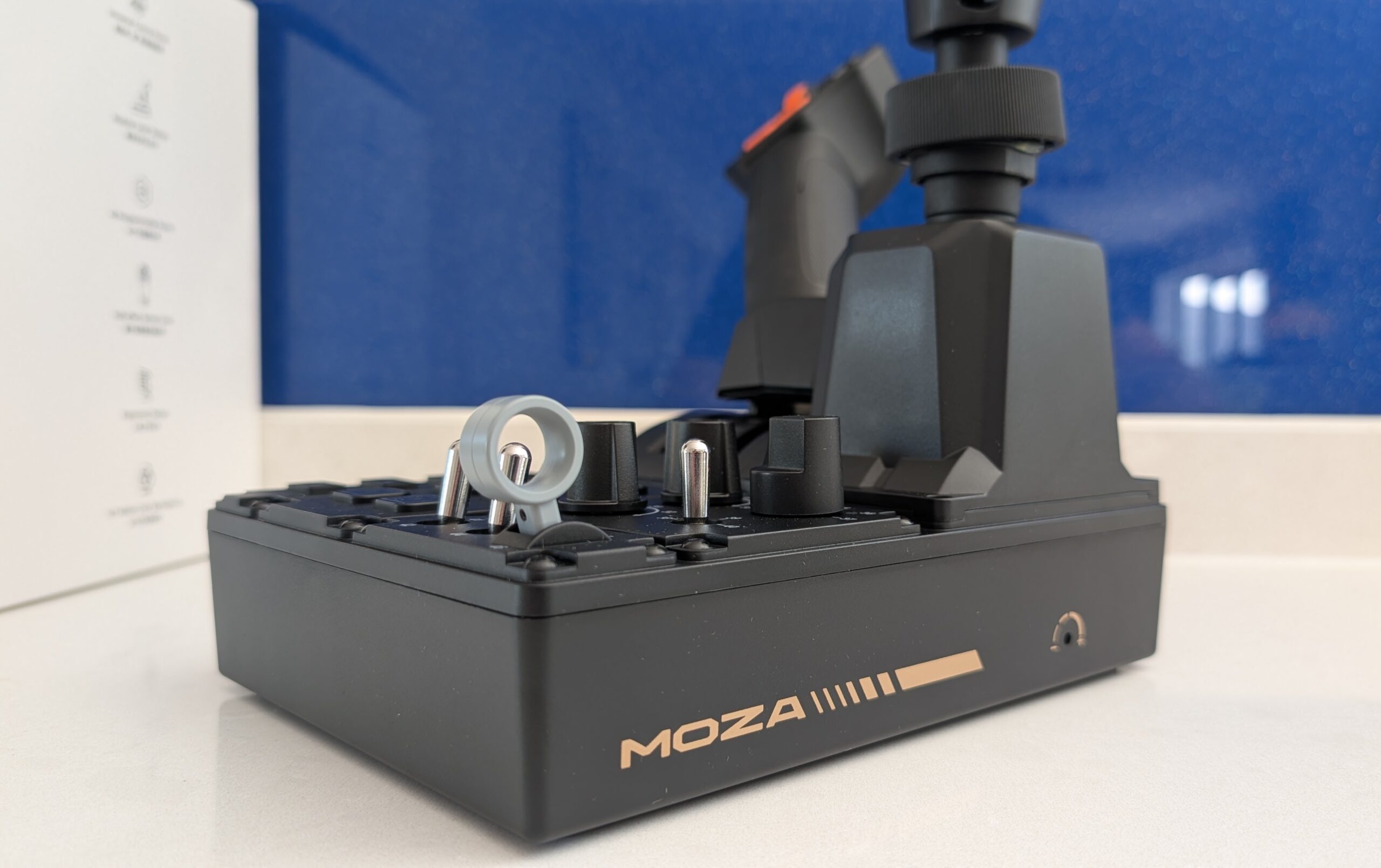 MOZA FCS control panel side profile with MOZA logo and front toggle switches