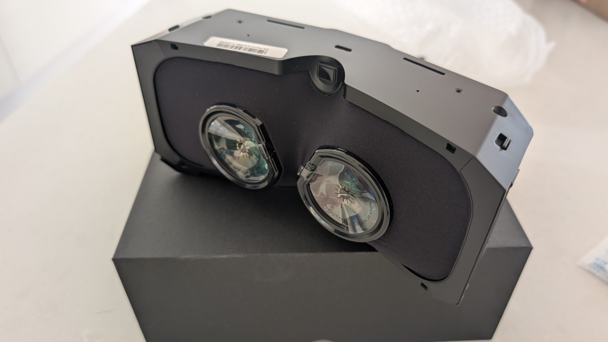 Front view of the Pimax micro-OLED optical engine showing both pancake lenses