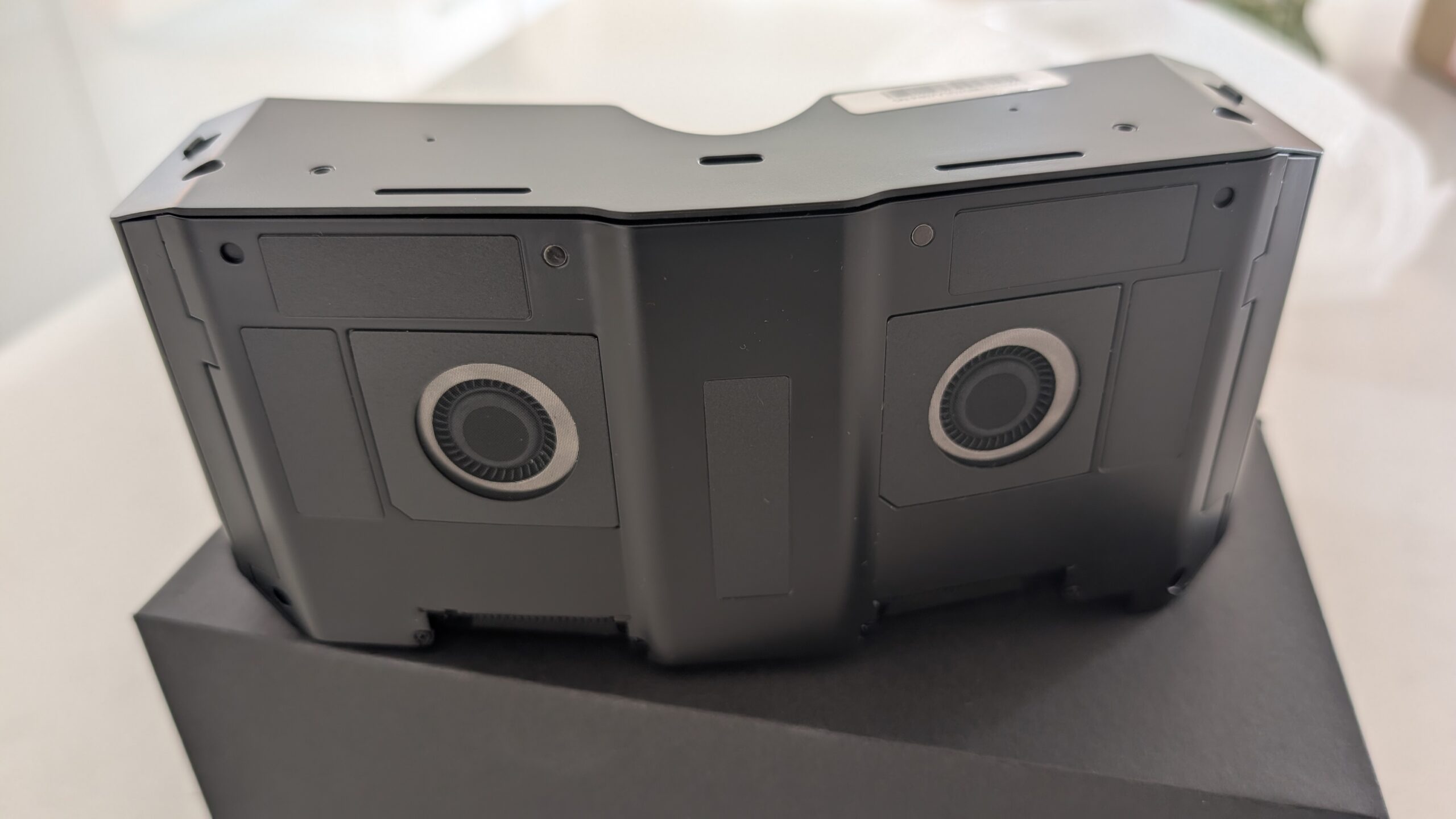 Rear face of the Pimax Crystal Super micro-OLED optical engine showing the integrated speaker pods