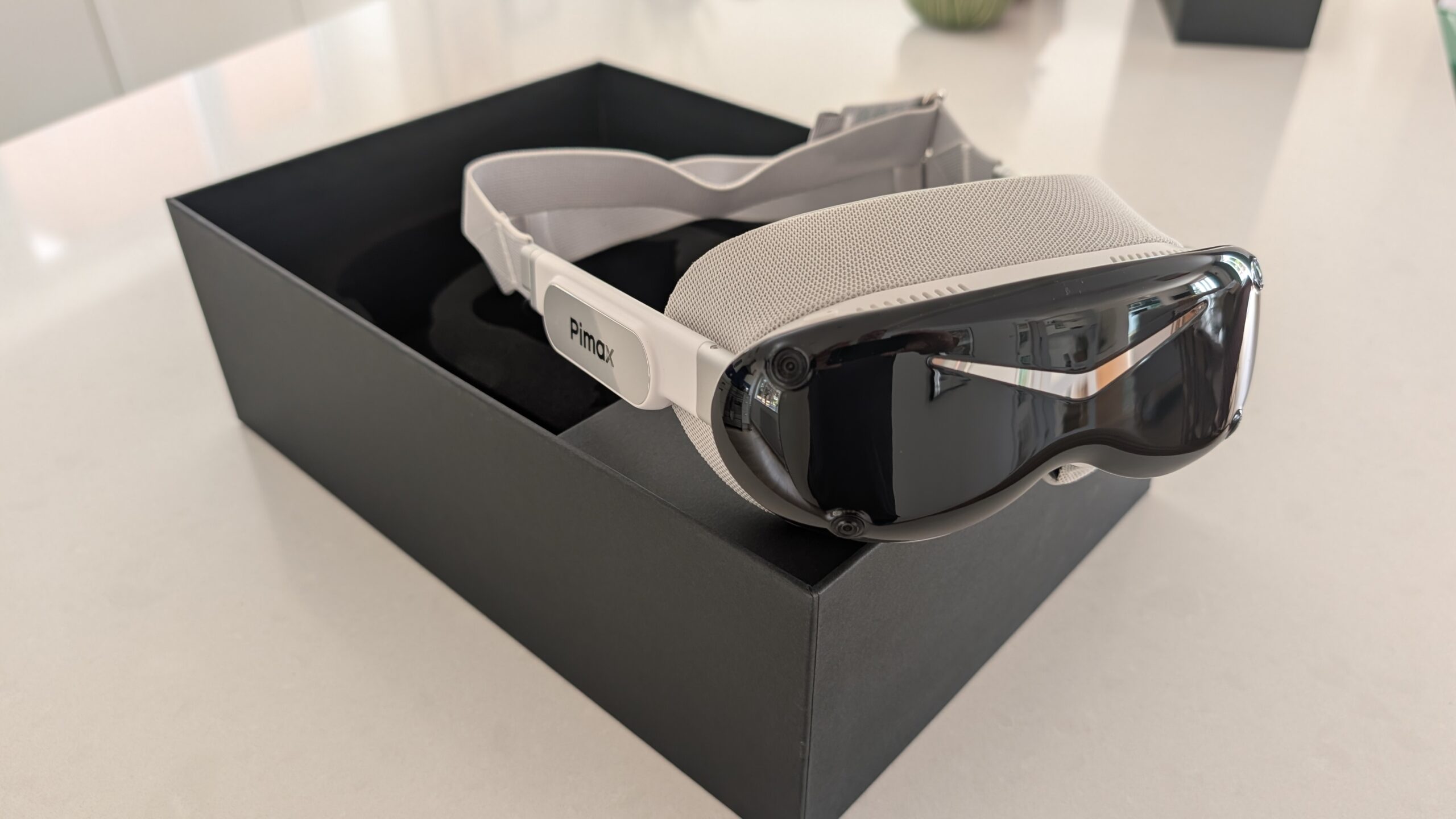 Pimax Dream Air SLAM edition in its box, showing the front cameras and fabric strap