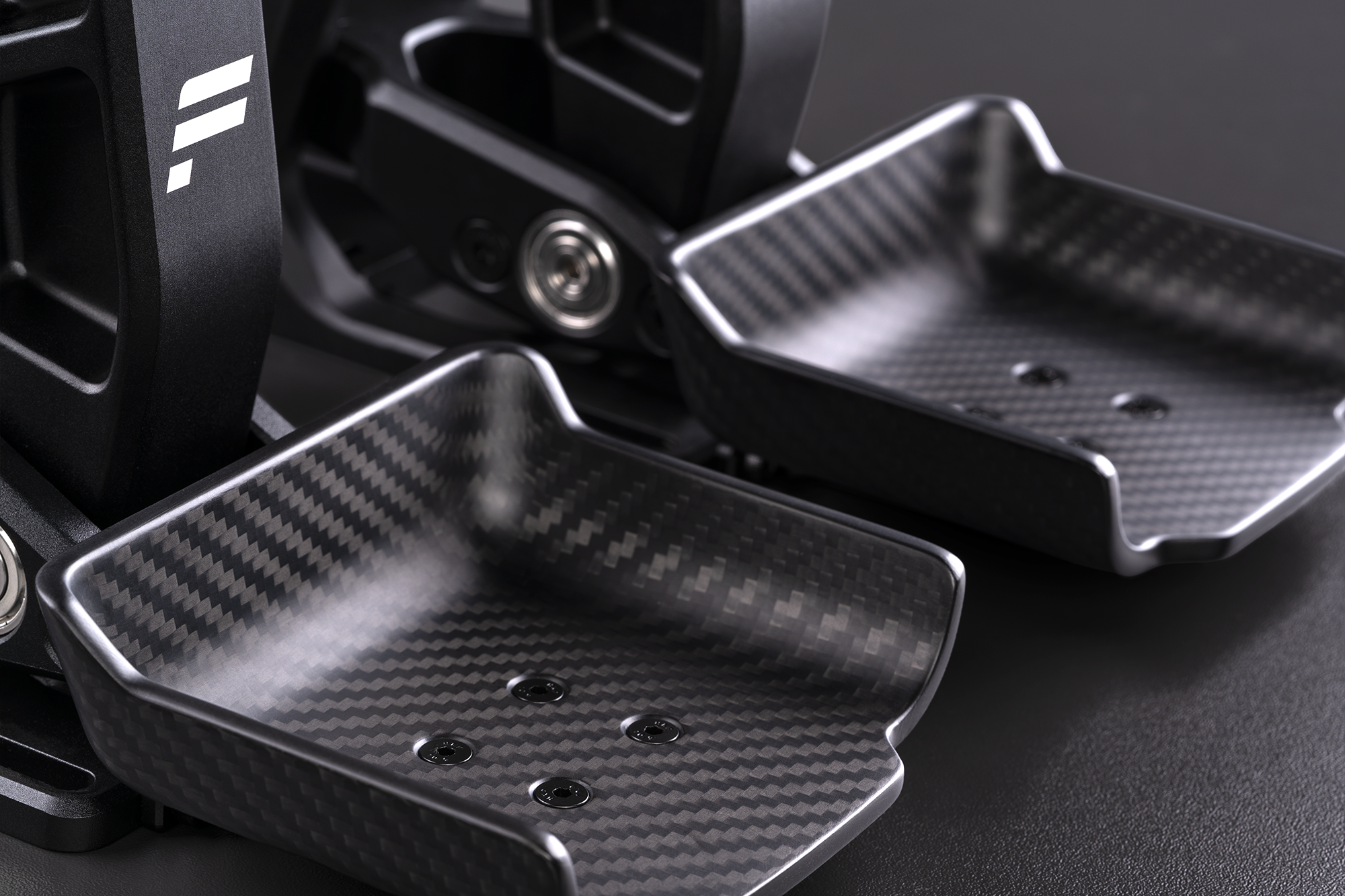 The two carbon-fibre footplates included with the Fanatec Podium Pedals Formula