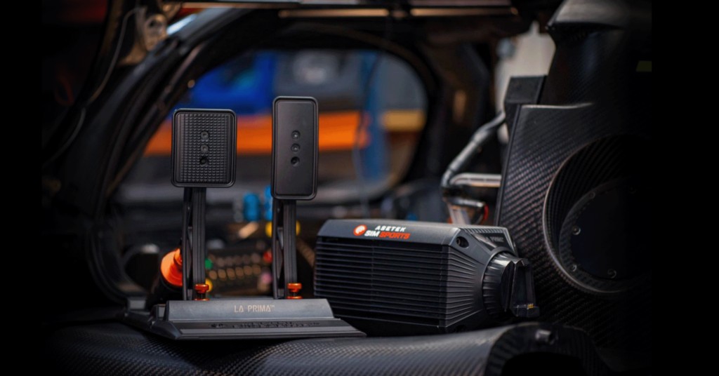 Asetek La Prima wheelbase and pedals in a race car cockpit