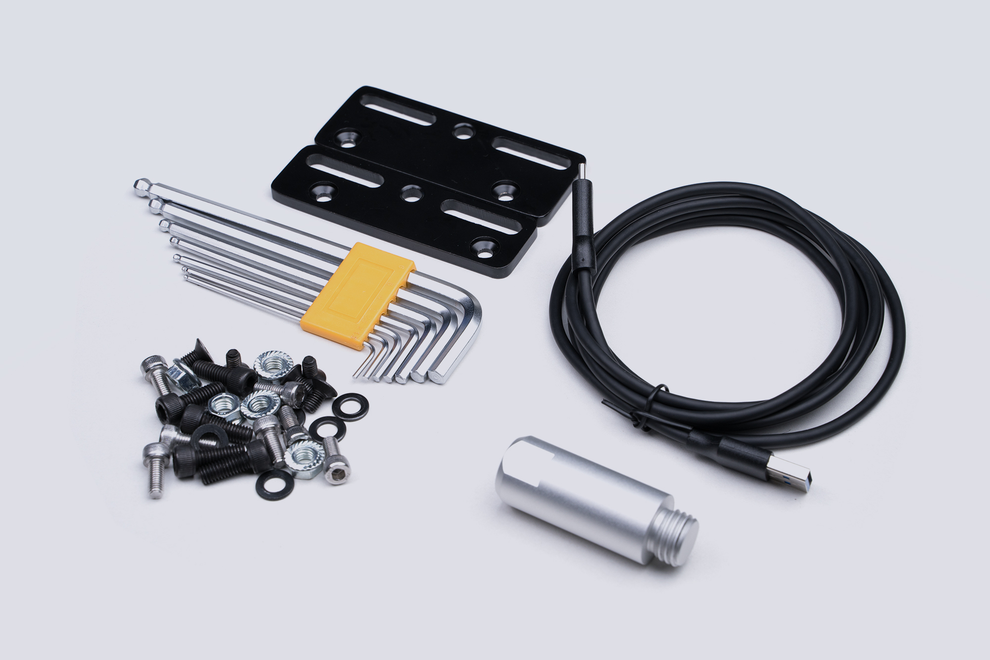 CONSPIT's photo of the CHS accessory kit: two flat adapter bars, ball-ended Allen keys, bolt bag, USB cable and the 50 mm extension link