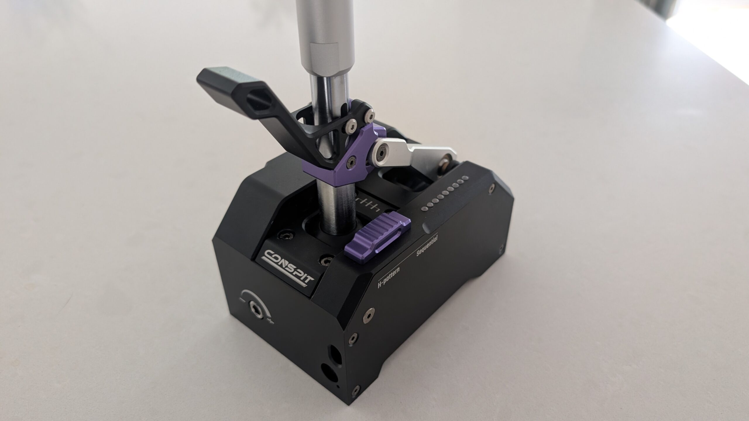 Front face of the CONSPIT CHS showing the CONSPIT logo and the hex resistance adjuster with its minus and plus arc