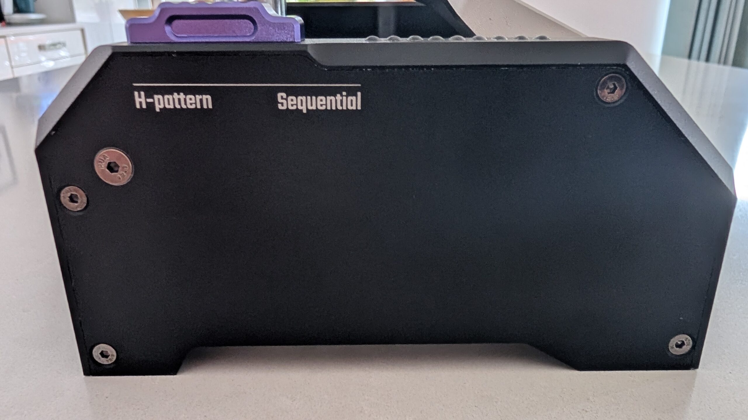Side plate of the CONSPIT CHS with H-pattern and Sequential labels next to the slider
