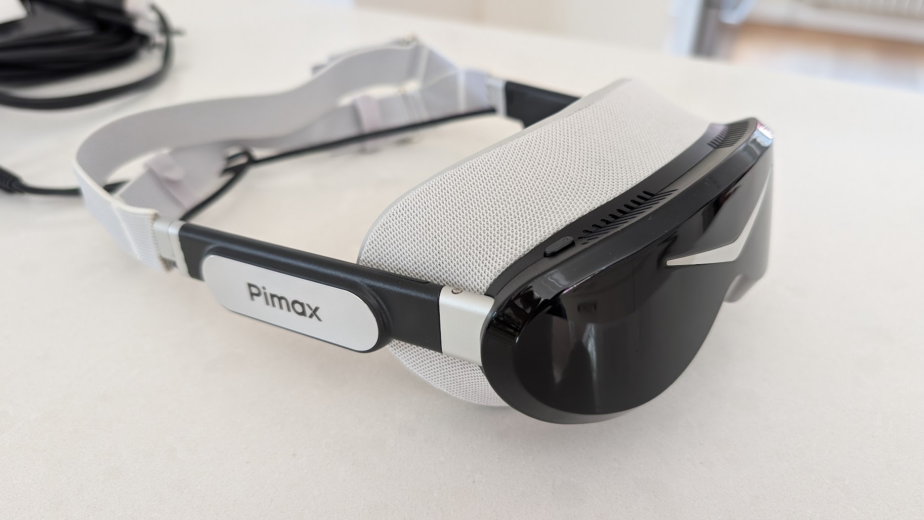 Pimax Dream Air from the side with the Pimax badge on the temple arm