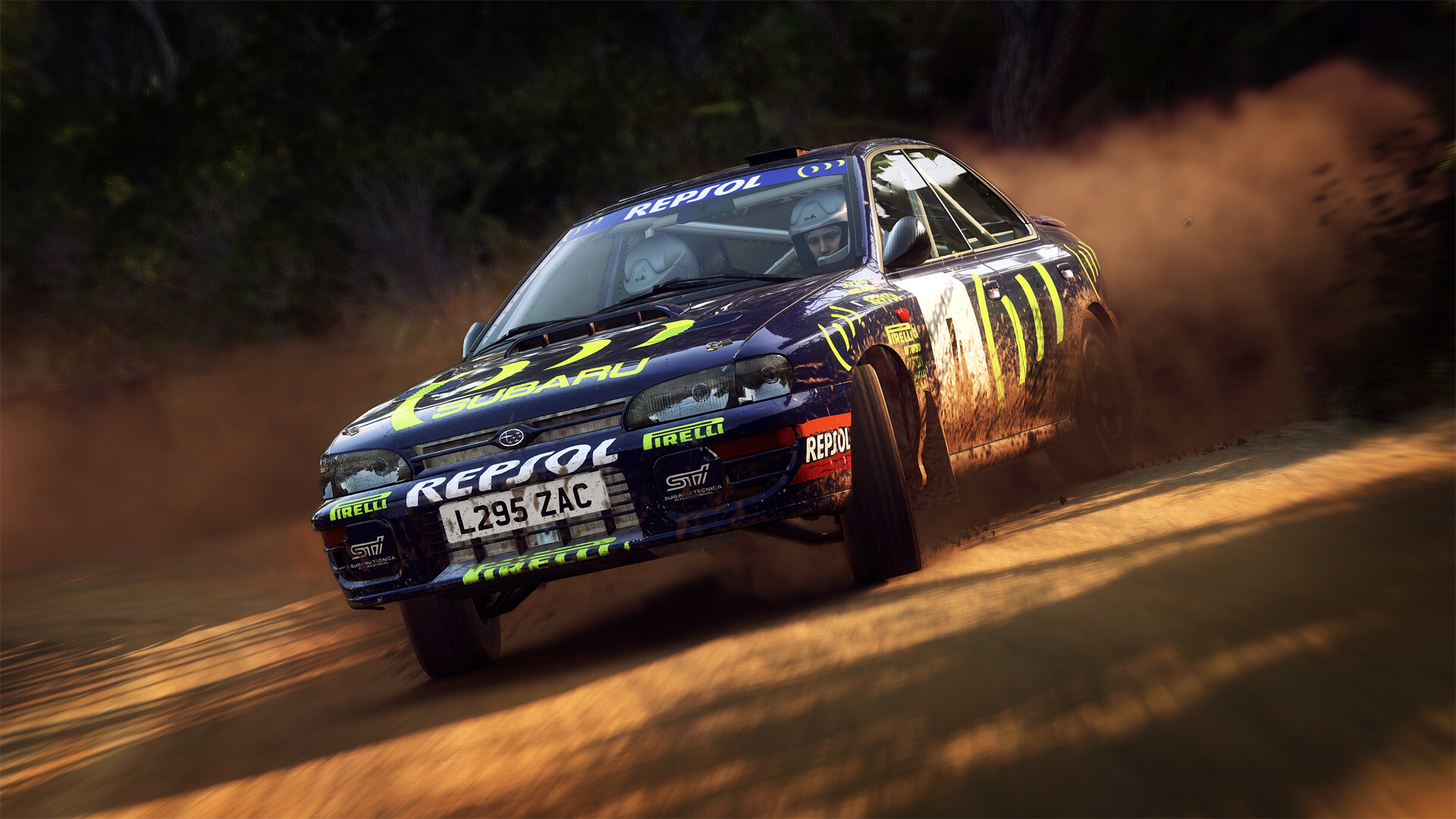 Blue Subaru Impreza rally car in Repsol livery sliding on a dusty gravel stage in DiRT Rally 2.0