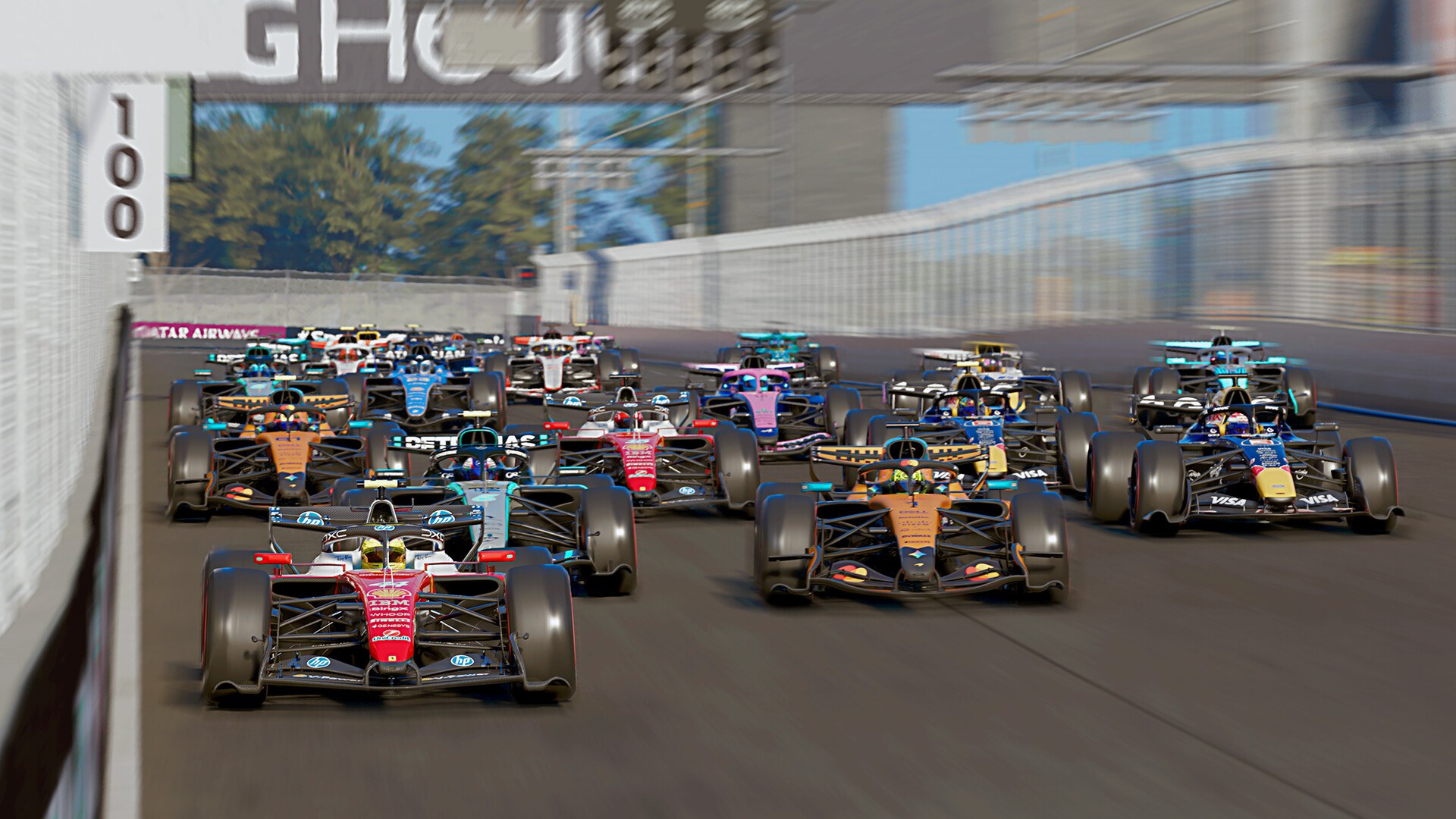 The F1 25 field getting away from the start on a street circuit