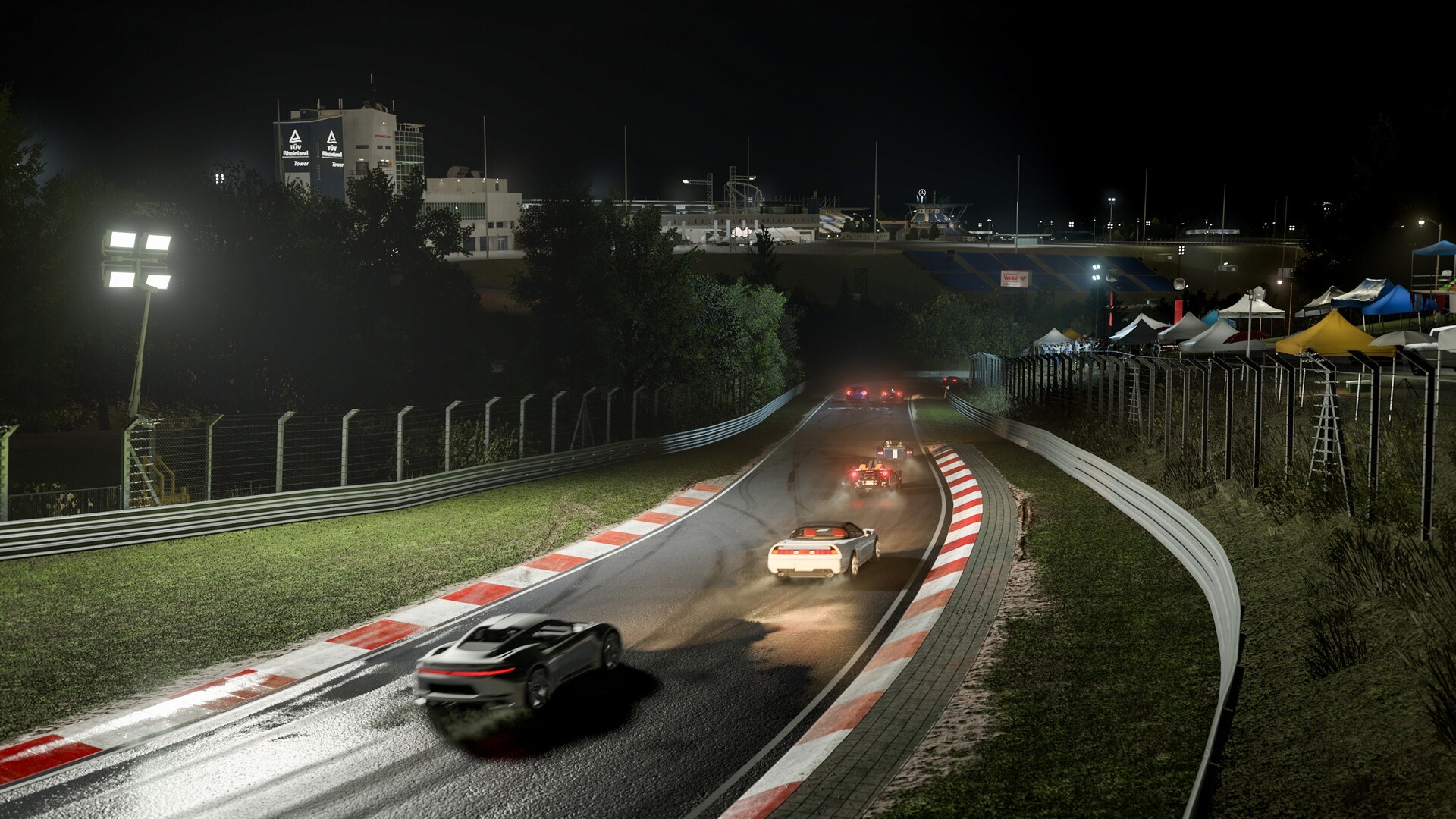 A pack of cars racing on a wet Nurburgring at night in Forza Motorsport