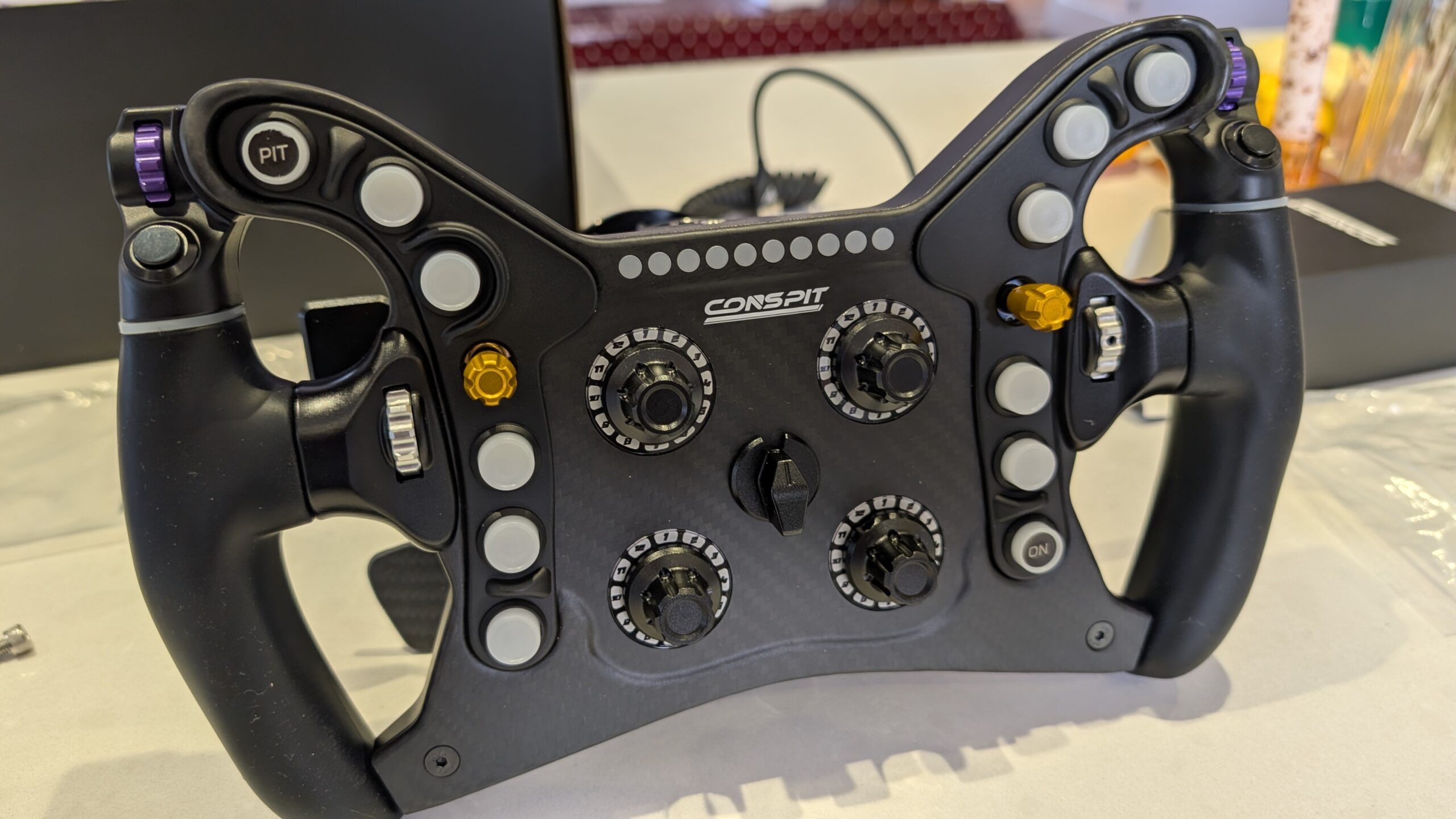 CONSPIT 280 FR front view with the lights off, showing the PIT and ON buttons, four rotary switches and the central selector