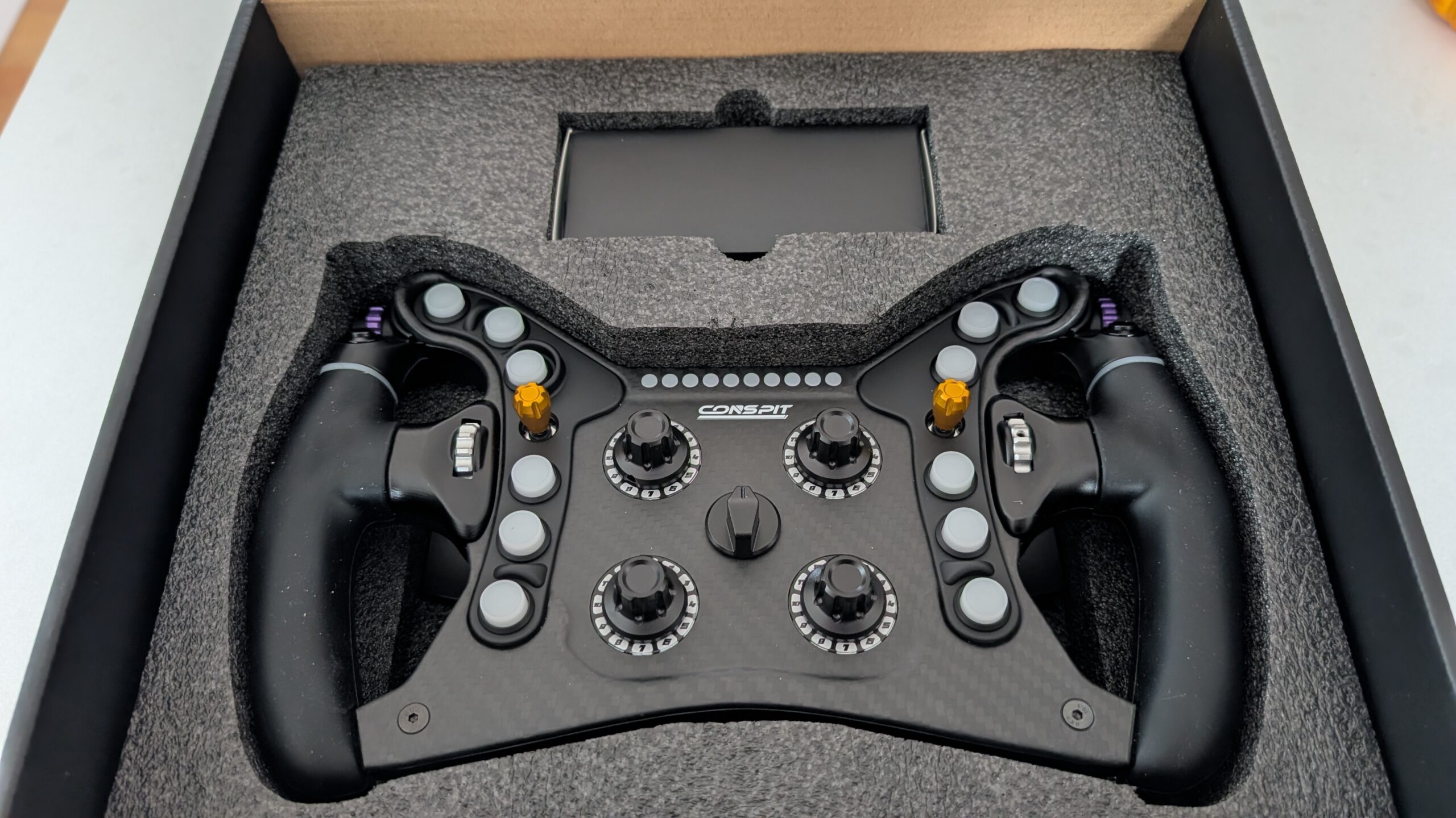 CONSPIT 280 FR in its box, sitting in a grey foam tray