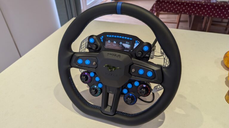 MOZA Ford Mustang GTD sim racing wheel from the front, with its display, blue backlit buttons and four lit rotary encoders