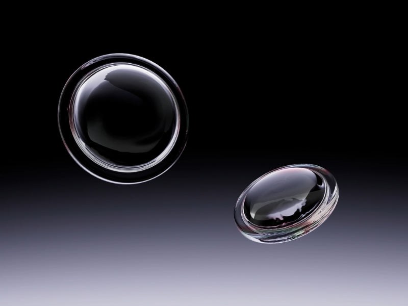 Render of two glass aspheric lenses