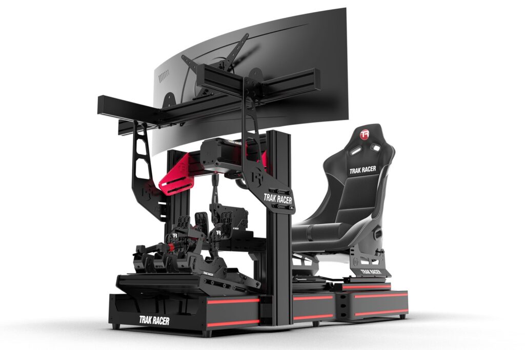 Trak Racer TR120S V2 aluminium profile cockpit with a seat and an ultrawide monitor mounted